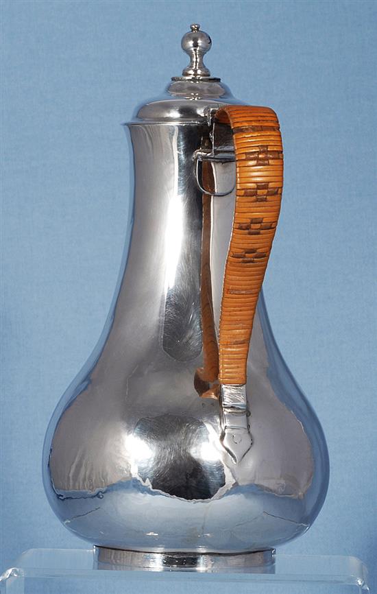 An Irish George III silver hot water pot, maker probably William Thompson, Height: 239mm gross weight: 14.7oz/460grms
